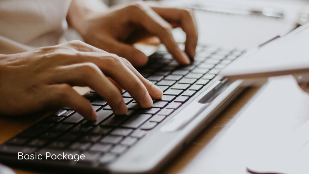 Person typing on a black key board